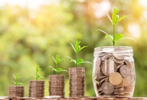 photo of coins in a jar and What is money? What is real wealth?